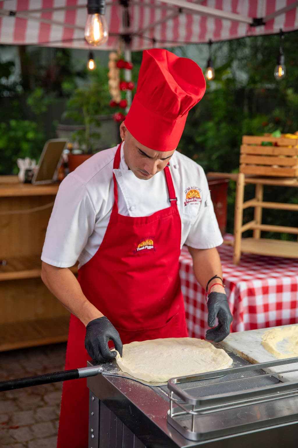 Wood-fired pizza served live at a Miami event