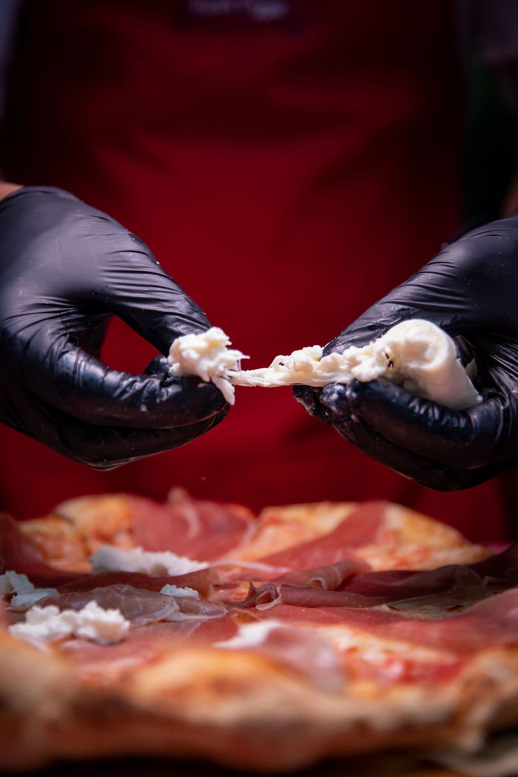 A slice of wood-fired pizza ready to serve