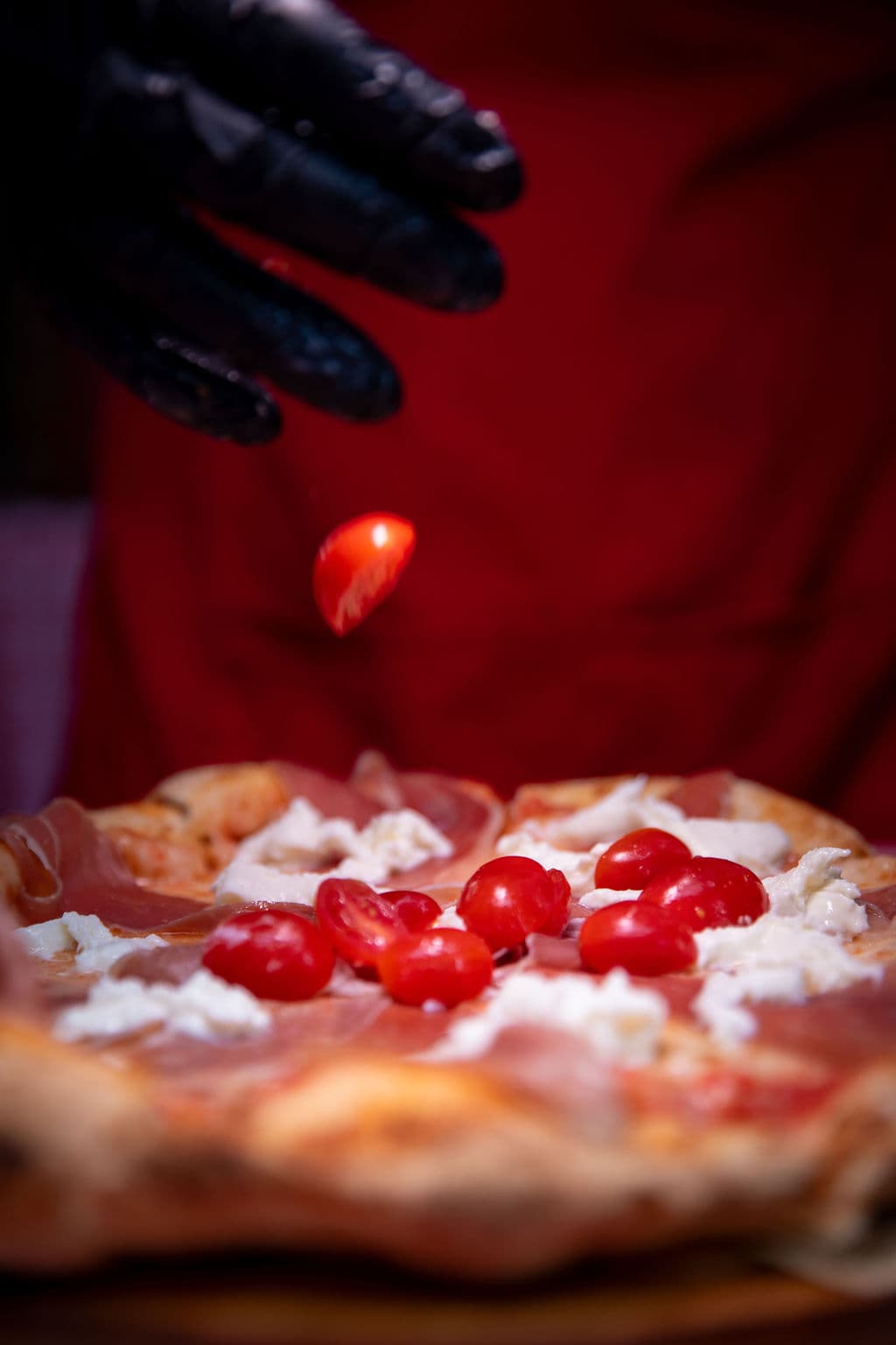 Wood-fired pizza served live at a Miami event